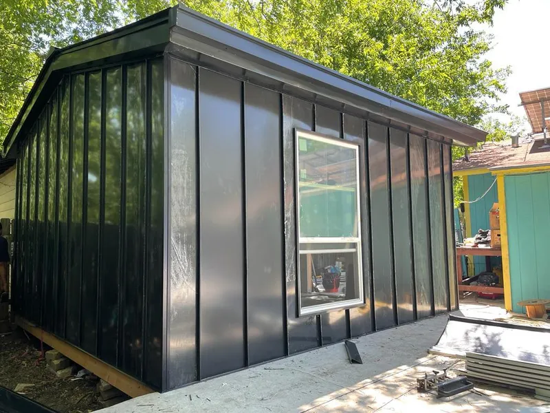 Black standing seam metal wall panels for Roof Inspection in Norway