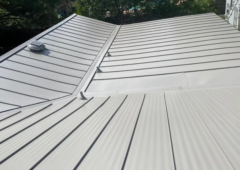 Solar attic fan installed on a metal roof for Roof Ventilation in Norway